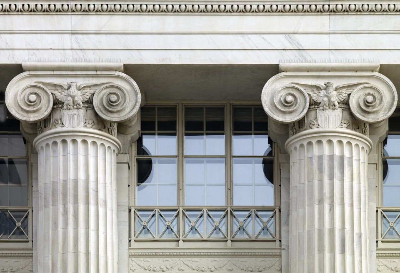 Close-up of two carved stone columns on a government building